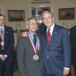 President George W. Bush poses with 2005 National Medal of Science recipient Dr. Anthony S. Fauci of The National Institute of Allergy and Infectious Diseases, Friday, July 27, 2007, in the Blue Room, after award ceremonies in the East Room of the White House. Also pictured are Dr. Tobin J. Marks (left) and Dr. Bradley Efron.  Photo by Eric Draper, Courtesy of the George W. Bush Presidential Library and Museum