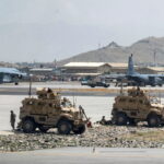 FILE PHOTO: U.S. Army soldiers assigned to the 82nd Airborne Division patrol Hamid Karzai International Airport in Kabul, Afghanistan August 17, 2021. Picture taken August 17, 2021.  U.S. Air Force/Senior Airman Taylor Crul/Handout via REUTERS/File Photo