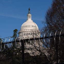 WASHINGTON, DC - JANUARY 14: Barbed wire is installed on security fencing surrounding the U.S. Capitol on January 14, 2021 in Washington, DC. Security has been increased throughout Washington following the breach of the U.S. Capitol last Wednesday, and leading up to the Presidential Inauguration. (Photo by Stefani Reynolds/Getty Images)