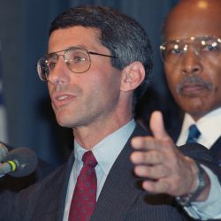 In 1989, Dr. Anthony Fauci (center) and then U.S. Health and Human Services Secretary Louis W. Sullivan (right) announced results of studies showing that the antiviral drug AZT had delayed the onset of disease in some people with HIV.